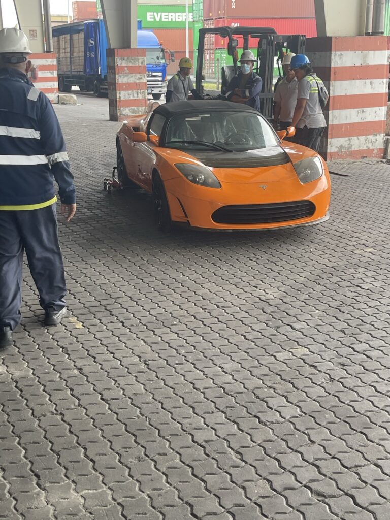 tesla abandoned roadster removed from crate in china