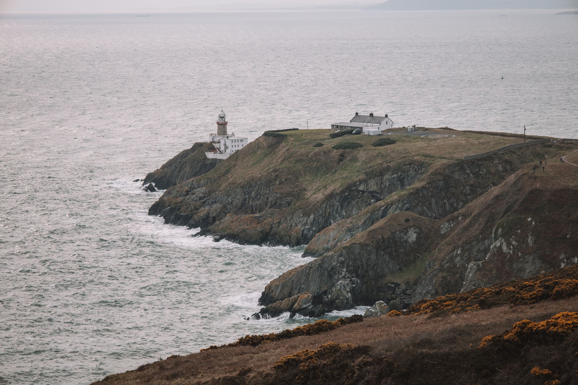 Sports car on coastal cliff road during a Northern Ireland driving route for car enthusiasts